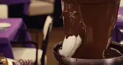 marshmallow dipped in chocolate fountain