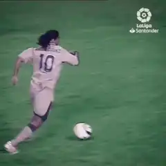 Soccer player dribbling past defenders