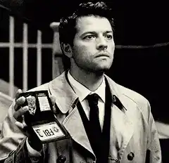Castiel shows his angel badge