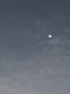 Crescent Moon in Cloudy Sky