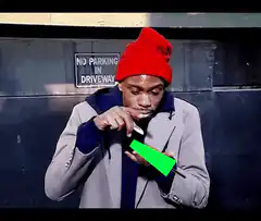 Man cutting green screen with knife