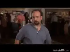 man drinks from bucket