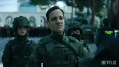 Man in military uniform salutes