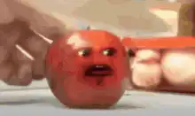 Annoying Orange gets sliced by a knife