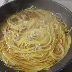 spaghetti boiling in a pan