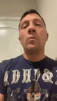 Man in ADHD shirt looking up