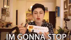 Woman eating and saying im gonna stop