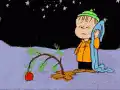 Charlie Brown decorates a small Christmas tree