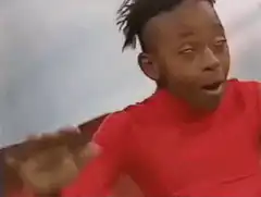 Man in red shirt waving hand