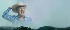 Two cowboys yelling in the desert
