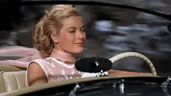 Grace Kelly driving a car