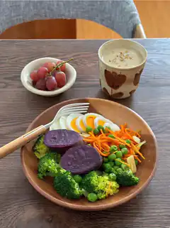 healthy meal with purple sweet potato and boiled eggs
