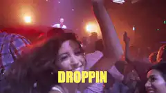 Woman dancing at club with DROPPIN text