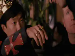 Ming as the Emperor kissing a ring