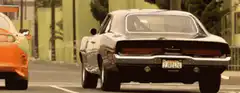 Orange Supra and black muscle car drag race