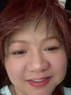 woman with red hair smiling
