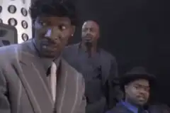 Man in suit laughing hysterically