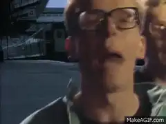 Two guys singing in a car