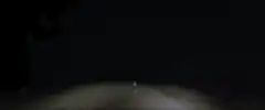 First person view driving on a dark road at night