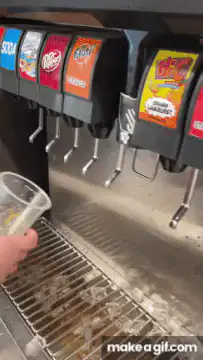 person mixing multiple sodas at fountain