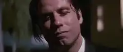 John Travolta blowing a kiss