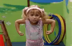Little girl flexing muscles