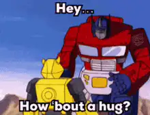 Optimus Prime hugs Bumblebee