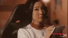 Woman with headset drawing on tablet