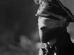 Man in hat smoking cigarette