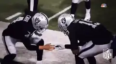 Oakland Raiders players fist bump