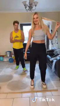 Couple dancing in living room