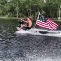Man grilling on jet ski with flag