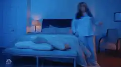 Woman falls asleep on mattress on floor