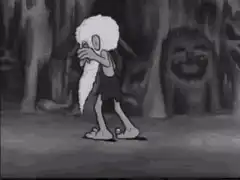 Caveman dancing in cave