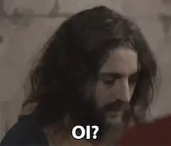 Man with long hair saying oi