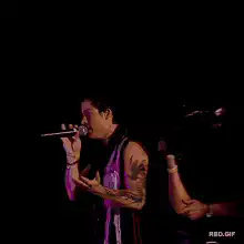 Adam Lambert singing on stage