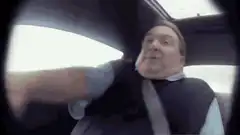 Man with distorted face driving car