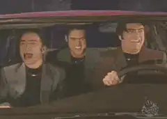 Three guys screaming in a car