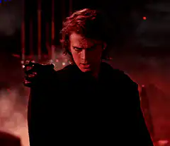 Anakin Skywalker points a blaster