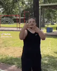 Man points at camera and laughs