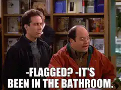 Jerry and George get flagged at the photo booth