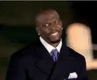 Terry Crews smiling and waving