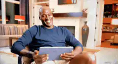 Shaquille O'Neal laughing at tablet