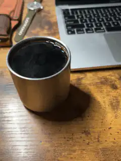 steaming coffee cup on desk
