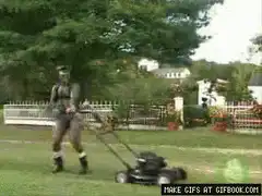 Soldier mowing lawn with lawnmower