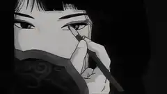 Woman applying eyeliner in black and white