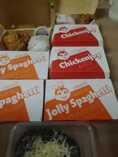 Jollibee meal boxes with fried chicken and spaghetti