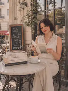 woman reading at cafe table