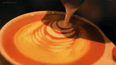 Latte art leaf pattern being poured