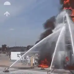 Firefighters battling a massive industrial explosion